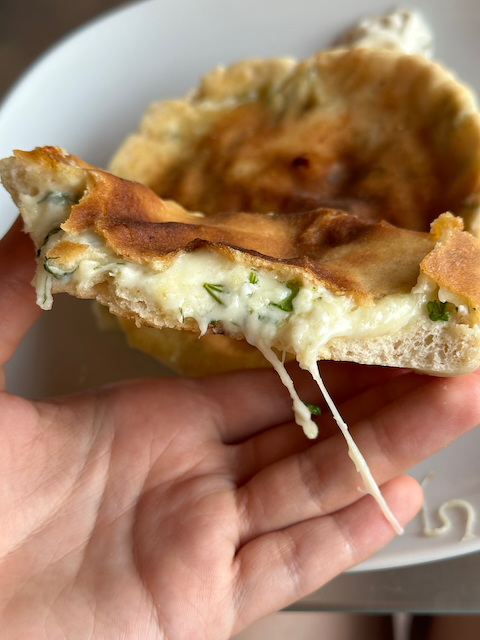 Sourdough pita bread filled with young cheese, cottage cheese and parsley&dill mix