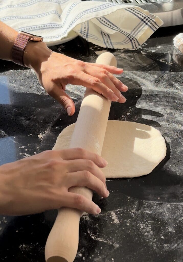 Rolling out sourdough pita